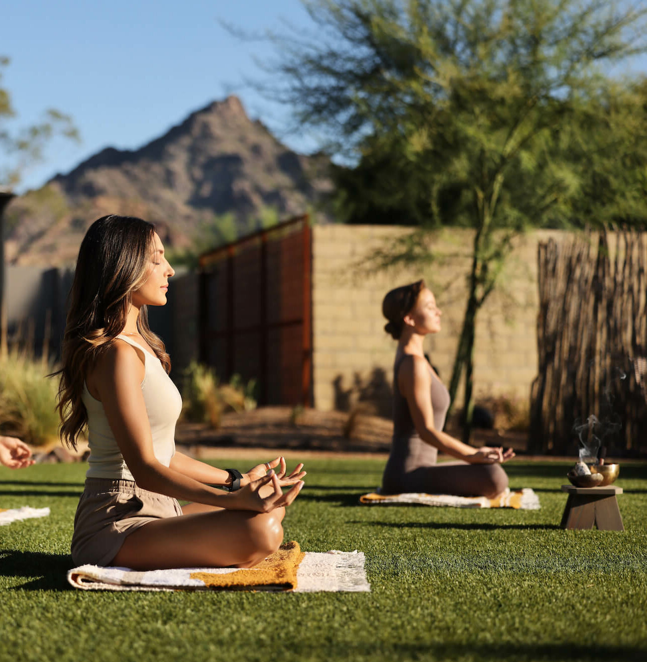 A group of women meditating on the grass at Tierra Luna Spa Retreat.